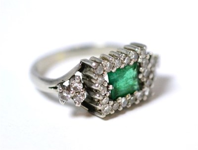 Lot 4 - An emerald and diamond cluster ring, a step cut emerald within a border of eight-cut diamonds,...