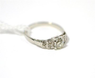 Lot 32 - A diamond ring, an old cut diamond in a white four claw setting, to eight-cut diamond set...