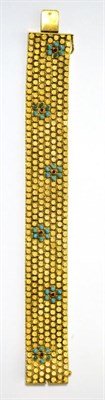 Lot 33 - A turquoise set bracelet, the brick links with textured applied disks interspersed with a...