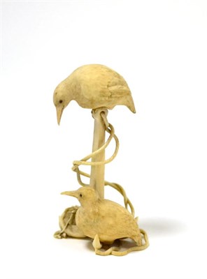 Lot 40 - A Japanese ivory Okimono, early 20th century, as two birds perched on an anchor, 9cm high