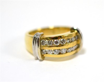 Lot 46 - A diamond two row ring, round brilliant cut diamonds in yellow channel settings, with white bar...