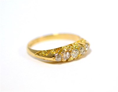 Lot 48 - An 18ct gold diamond five stone ring, the graduated old cut diamonds in yellow claws, on a...