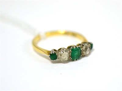 Lot 51 - An emerald and diamond five stone ring, an emerald-cut emerald between two old cut diamonds and two