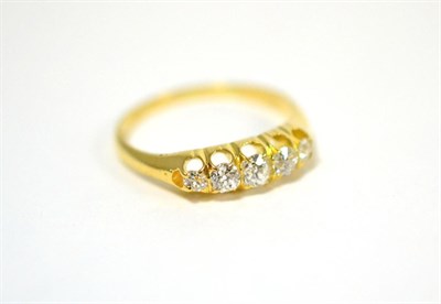 Lot 57 - A Victorian diamond five stone ring, the graduated old cut diamonds in a yellow claw setting, total