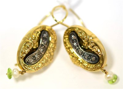 Lot 58 - A pair of drop earrings, of almost oval form, inset with rose cut diamonds, a small pearl and green