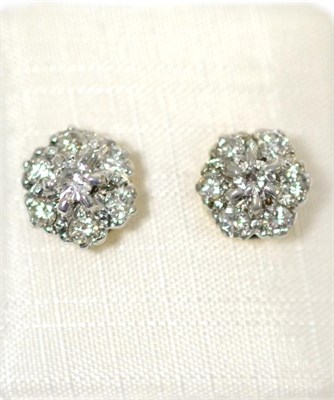 Lot 60 - A pair of 18ct gold diamond cluster earrings, round brilliant cut diamonds in white claw...