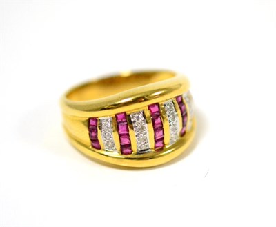 Lot 67 - A ruby and diamond ring, vertical rows of step cut rubies alternate with rows of round...