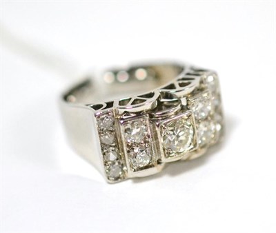 Lot 78 - A geometric diamond set ring, an old cut diamond in white claw and square setting, between...