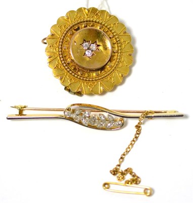 Lot 85 - A diamond bar brooch, old cut diamonds within white millegrain leaf settings, to a cross-over...
