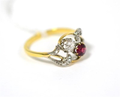 Lot 89 - A ruby and diamond cluster ring, a round cut ruby and an old cut diamond in white claw settings...