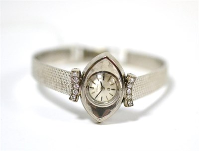Lot 93 - A lady's 18ct white gold and diamond set wristwatch, signed Omega, circa 1965, lever movement,...