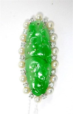 Lot 95 - A jade, cultured pearl and diamond set brooch, of lozenge form, the jade carved with a foliate...