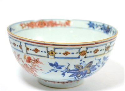 Lot 102 - A Chinese Imari punch bowl, circa 1730, painted with flower sprays below a panelled border,...