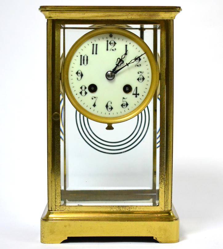 Lot 114 - ^A brass four glass mantel clock, circa 1900, 3-1/2-inch Arabic enamel dial, twin barrel...