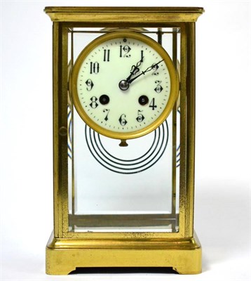 Lot 114 - ^A brass four glass mantel clock, circa 1900, 3-1/2-inch Arabic enamel dial, twin barrel...