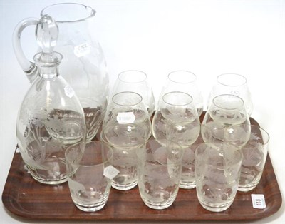 Lot 118 - A 20th century glass drinks service engraved with animals after Rowland Ward, comprising a decanter