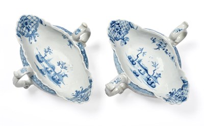 Lot 124 - A pair of First Period Worcester two handled sauce boats painted in underglaze blue with the...