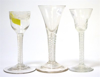 Lot 133 - Three 18th century air twist wine glasses, 15cm, 16cm, 14.5cm