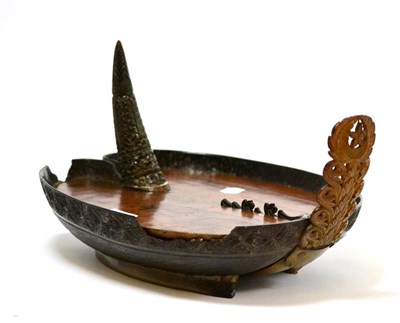 Lot 136 - Coco de mer nut, a large half shell converted into a tray with carved decoration to the outer...