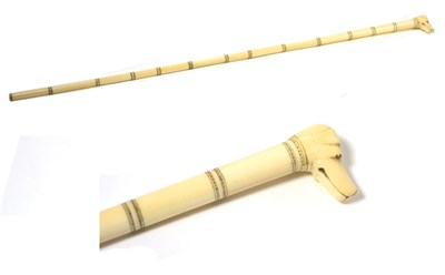 Lot 139 - A Victorian ivory cane with the handle depicting a dog's face