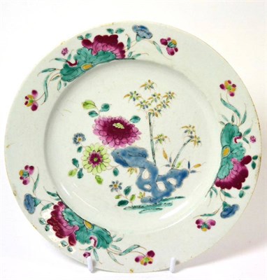 Lot 141 - ^A Bow porcelain plate, circa 1770, painted in famille verte enamels, 33cm diameter