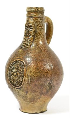 Lot 144 - A 17th century stoneware Bellarmine jug of typical form, 22cm high