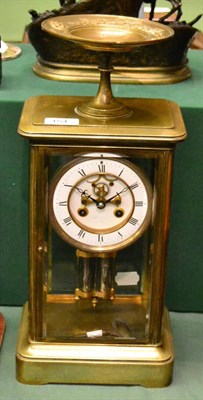 Lot 154 - A brass four glass striking mantel clock, circa 1890, bevelled glass panels, surmounted by a...
