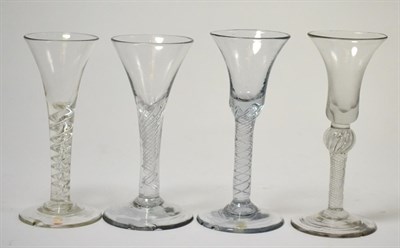Lot 159 - Four various 18th century wine glasses on air twist stems