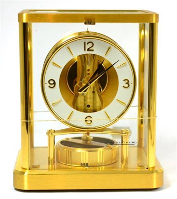 Lot 166 - A brass atmos clock, signed Jaeger le Coultre, 20th century, glazed panels, 4-1/2-inch dial,...