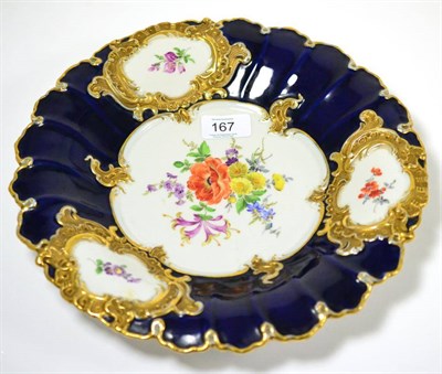 Lot 167 - A late 19th/early 20th century Meissen blue and gilt decorated plate, 30cm diameter