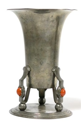 Lot 176 - An Art Nouveau pewter vase raised on three feet set with Bakelite cabochons by Brodrene Mylius,...
