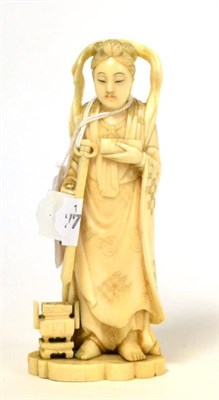 Lot 184 - A 19th century Japanese ivory Okimono of a deity, holding a sword, a koro at her feet, 13.5cm high