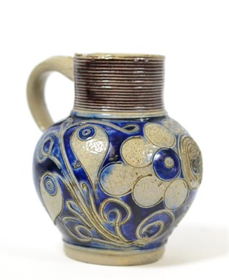 Lot 189 - An 18th century Westerwald scratch blue jug, initialled 'GR', 11cm high
