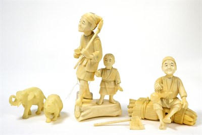 Lot 198 - A Japanese ivory group of figures, Meiji period, including a wood cutter and a wine merchant,...
