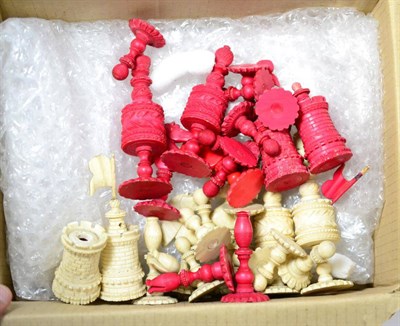 Lot 211 - Late 19th/early 20th century ivory and stained red ivory chess pieces