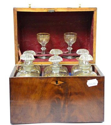 Lot 231 - A George III mahogany six bottle decanter box, circa 1800, containing six gilt highlighted...