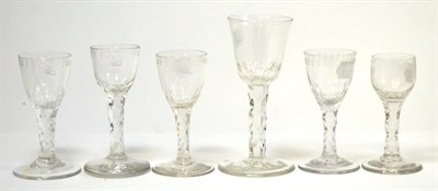 Lot 236 - An 18th century wine glass with faceted stem, 16.5cm high, and five various wine glasses with...