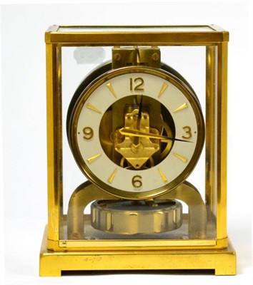 Lot 243 - A brass atmos clock, signed Jaeger LeCoultre, 20th century, glazed panels, 4-1/4-inch dial,...