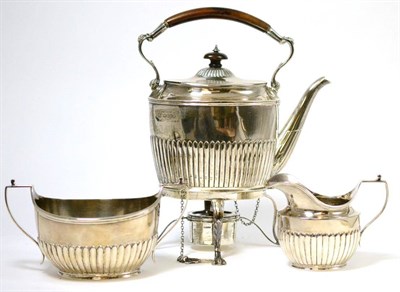 Lot 244 - A Victorian silver spirit kettle on stand and matching milk jug and sugar bowl