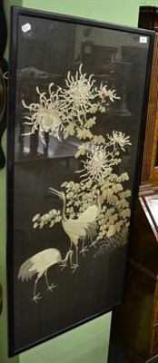 Lot 249 - A Japanese silkwork panel depicting cranes amongst chrysanthemum, 123cm by 57cm