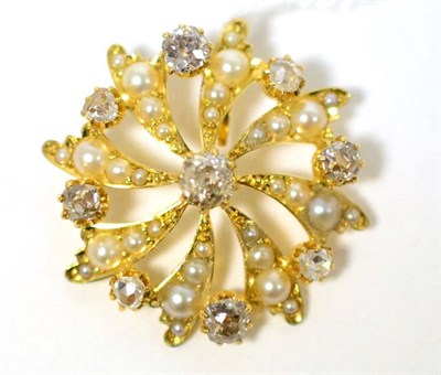 Lot 255 - A diamond and split pearl pendant, an old cut diamond in yellow claw setting with radiating scrolls