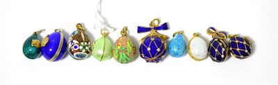 Lot 265 - Nine egg charms and an ball, enamelled in assorted colours, some hinged to open