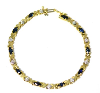 Lot 283 - A sapphire and diamond bracelet, marquise cut sapphires in yellow claw settings, spaced by...