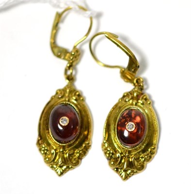 Lot 285 - A pair of garnet drop earrings, an oval cabochon garnet inset with an eight-cut diamond in a yellow