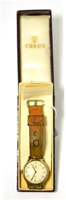Lot 304 - A 9ct gold wristwatch, signed Tudor, 1956, lever movement, silvered dial with Arabic numerals,...