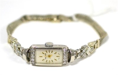 Lot 328 - A lady's diamond set wristwatch, lever movement, silvered dial inscribed Waltham, rectangular...