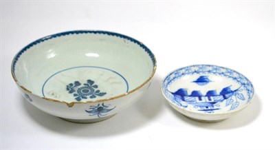 Lot 345 - A Liverpool delft shallow bowl painted in blue with flowers, 20cm, and a saucer painted with...