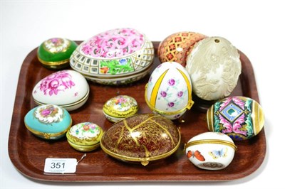 Lot 351 - A tray including twelve assorted porcelain egg shaped caskets to include Limoges, Continental...