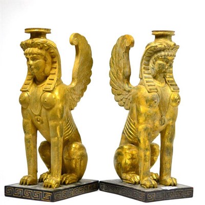 Lot 361 - A pair of Egyptian revival gilt decorated candlesticks, 30cm high