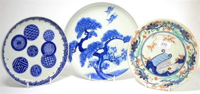 Lot 370 - An 18th century Imari porcelain saucer dish, decorated with landscape, 21.5cm diameter, and two...